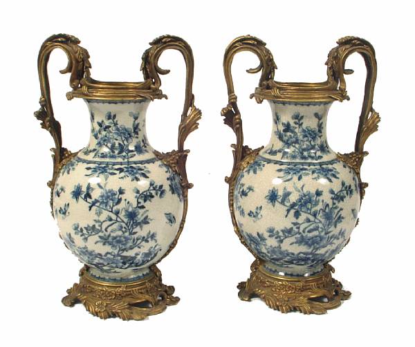 Appraisal: A pair of blue and white porcelain urns with bronze