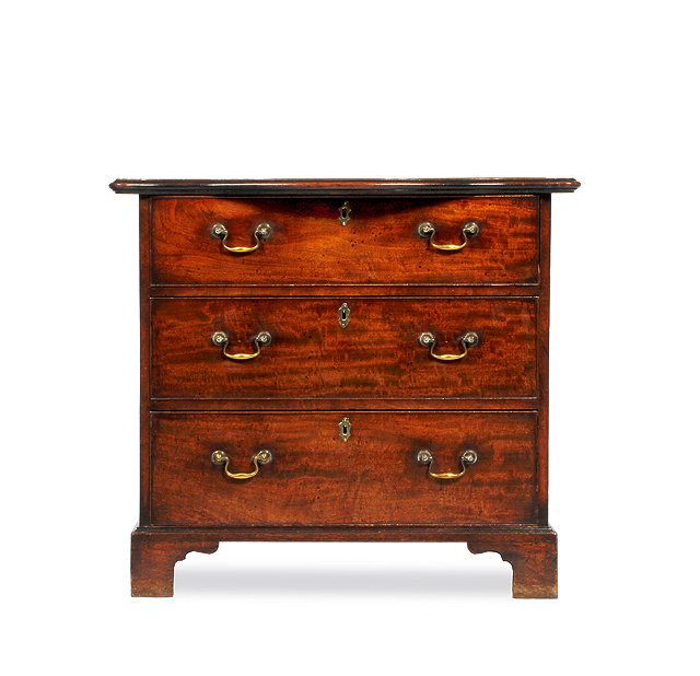 Appraisal: A GEORGE III MAHOGANY GENTLEMAN'S DRESSING CHEST with serpentine top