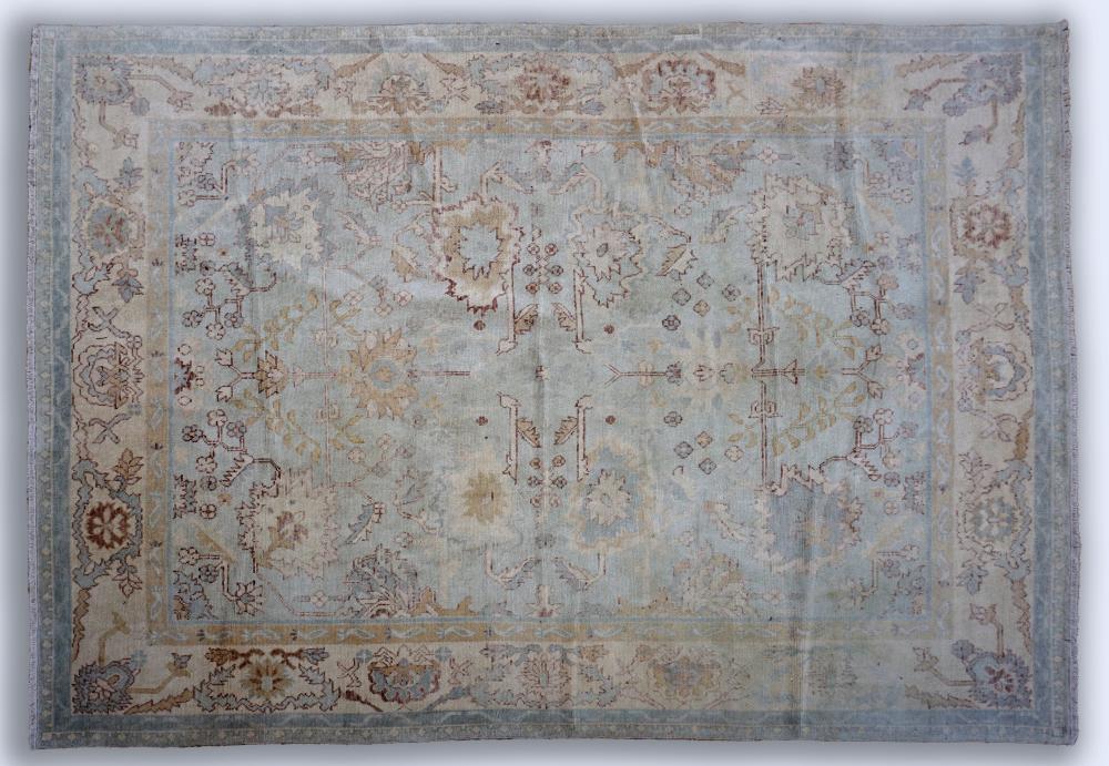 Appraisal: VINTAGE TURKISH HAND KNOTTED WOOL RUG scattered geometric shapes in