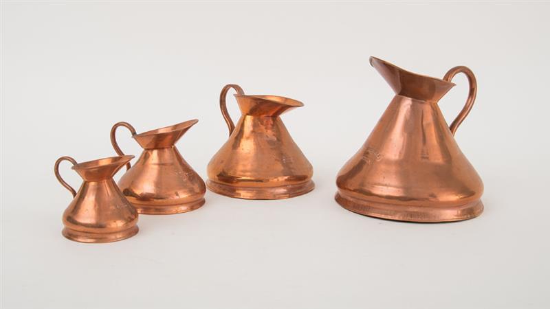 Appraisal: FOUR ENGLISH COPPER FUNNEL-SHAPE IMPERIAL MEASURE PITCHERS Variously marked 'Imperial-Gill'