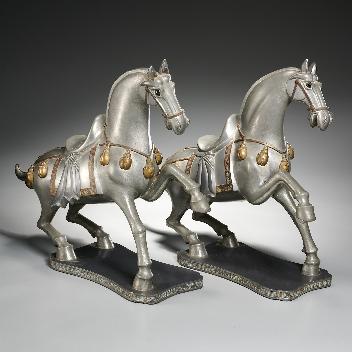 Appraisal: LARGE PAIR GUMP'S TANG STYLE PEWTER HORSES Mid th c