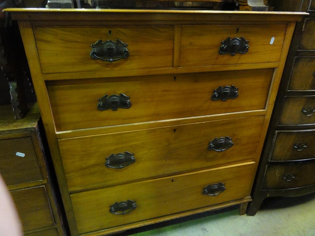 Appraisal: An Edwardian satin walnut chest fitted with three long and