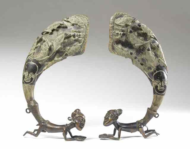 Appraisal: PAIR AFRICAN BRONZE HORN DISPLAYS on figural male and female