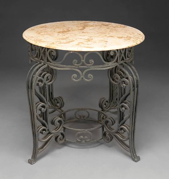 Appraisal: A pair of Rococo style wrought iron center tables first