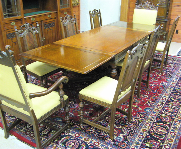 Appraisal: TEN-PIECE WALNUT DINING SET American c 's comprising rectangular draw-leaf