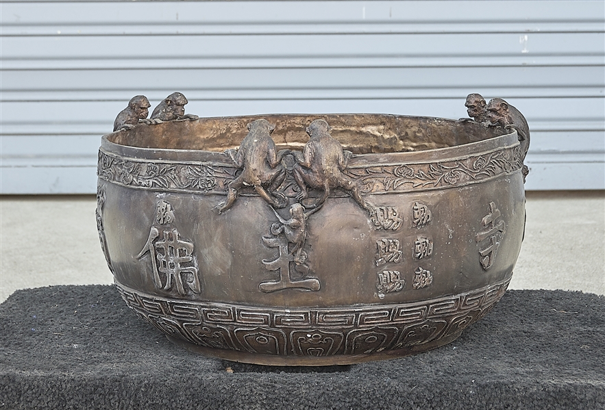 Appraisal: Chinese bronze censer depicting monkeys in high relief and characters