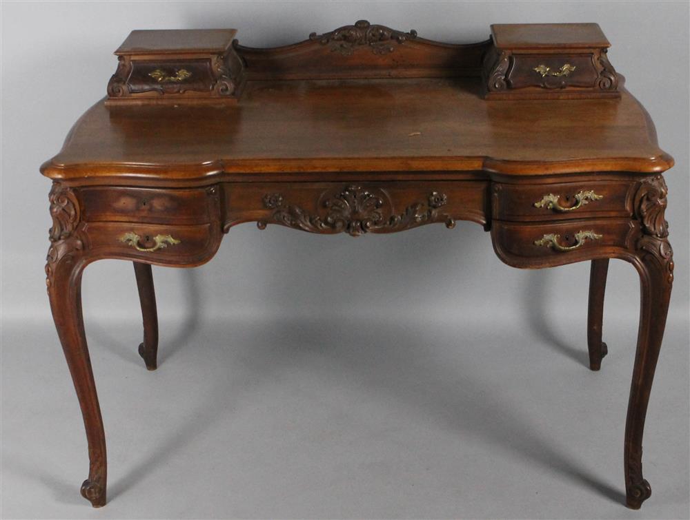 Appraisal: LOUIS XV STYLE MAHOGANY WRITING DESK The shaped top surmounted