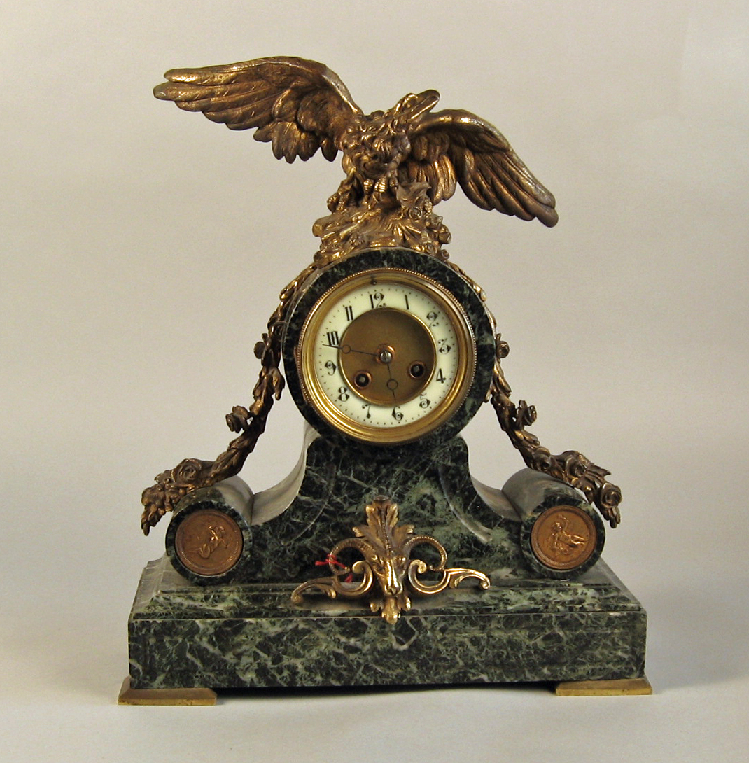 Appraisal: Gilt-bronze and green marble mantel clock The gilded dial with