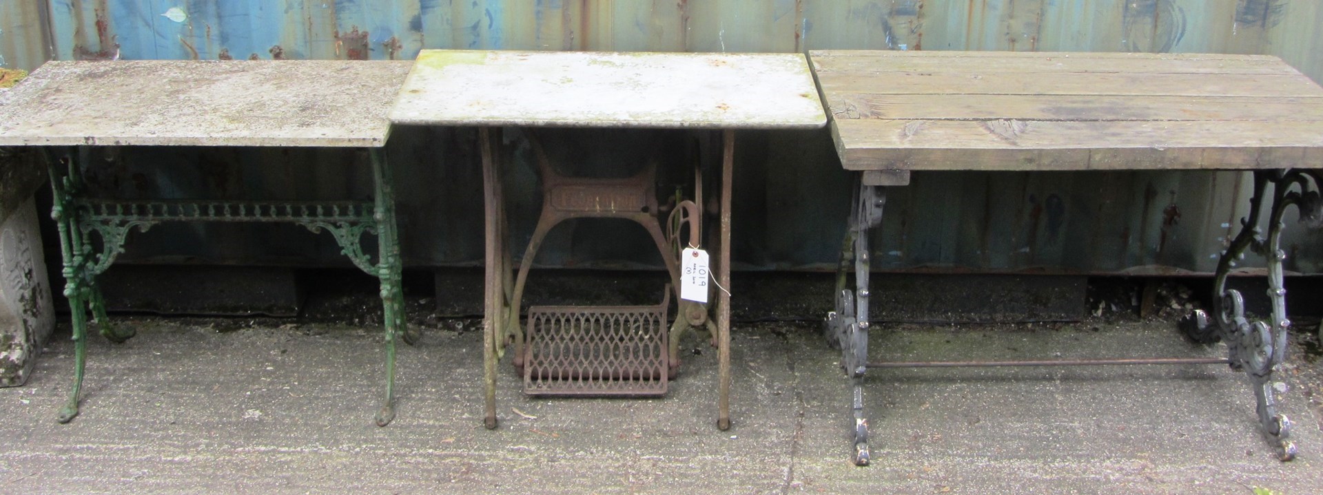 Appraisal: Three various cast iron table bases one with wooden top