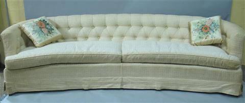 Appraisal: 'S WHITE UPHOLSTERED CURVED-BACK SOFA The chic curved button-tufted back