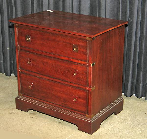 Appraisal: A pair campaign style mahogany chest of drawers mid th