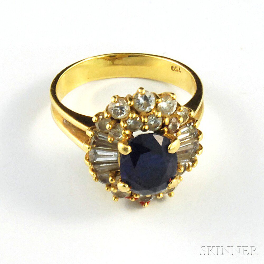 Appraisal: kt Gold Sapphire and Diamond Ring the oval-cut sapphire measuring