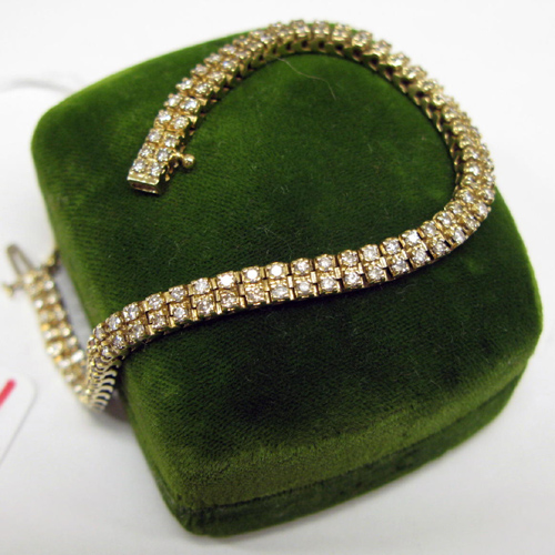 Appraisal: DIAMOND AND FOURTEEN KARAT GOLD BRACELET inches in length with