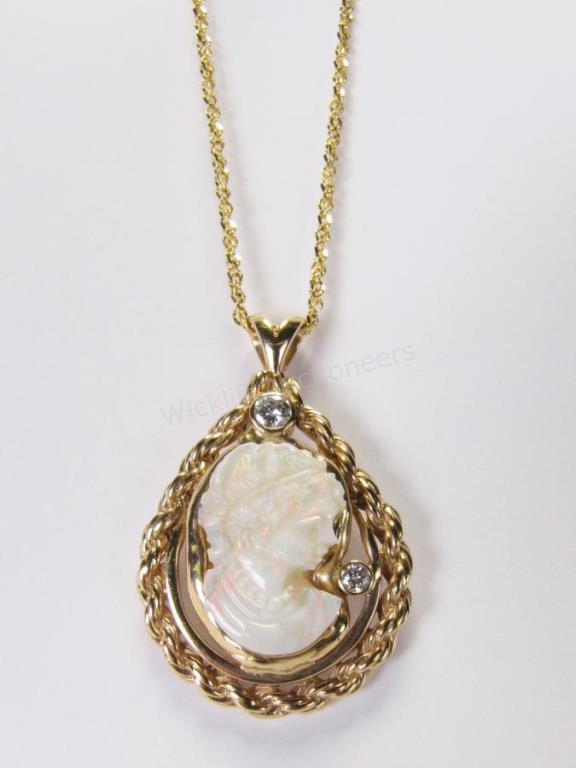 Appraisal: A K yellow gold pendant with carved opal cameo lady