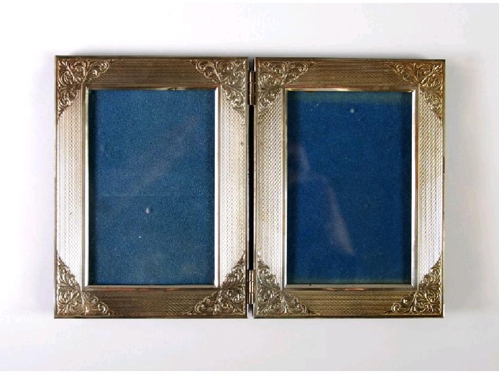 Appraisal: STERLING SILVER FRONTED DESK TOP FOLDING DOUBLE PHOTOGRAPH FRAME engine