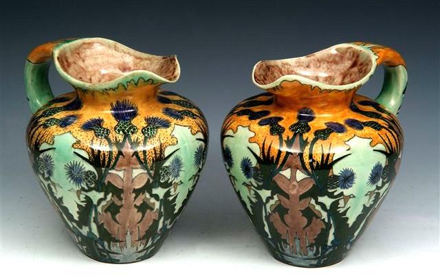 Appraisal: A PAIR OF BRANTJES DUTCH FAIENCE ART NOUVEAU JUGS Brantjes