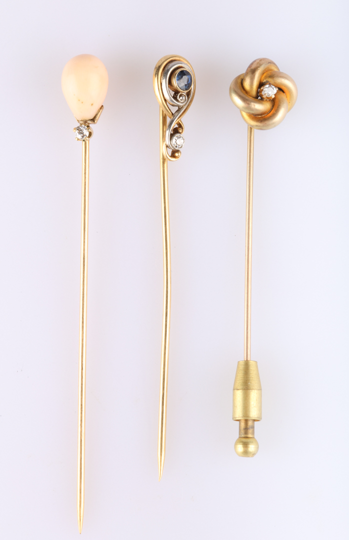 Appraisal: Three Stickpins in Gold K love knot motif with diamond