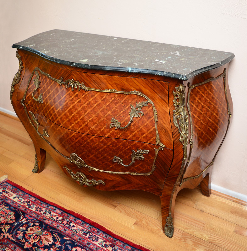 Appraisal: FRENCH STYLE MARBLE TOP COMMODE Polished black marble beveled and