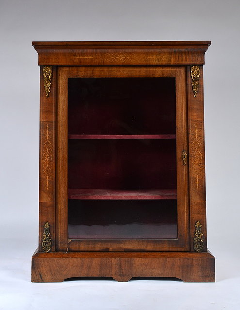 Appraisal: A Victorian walnut and inlaid pier cabinetwith gilt metal mounts