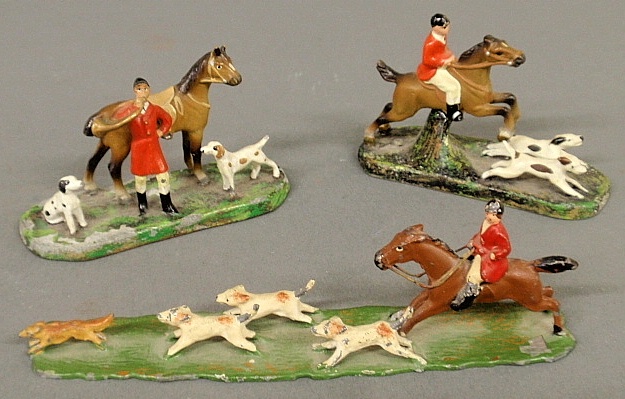 Appraisal: - Two Austrian painted lead fox hunter figural groups h