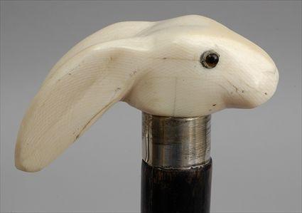 Appraisal: STAINED WALNUT WALKING STICK WITH CARVED IVORY RABBIT HEAD HANDLE