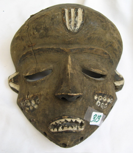 Appraisal: AN AFRICAN HAND CARVED FACE MASK with traces of white