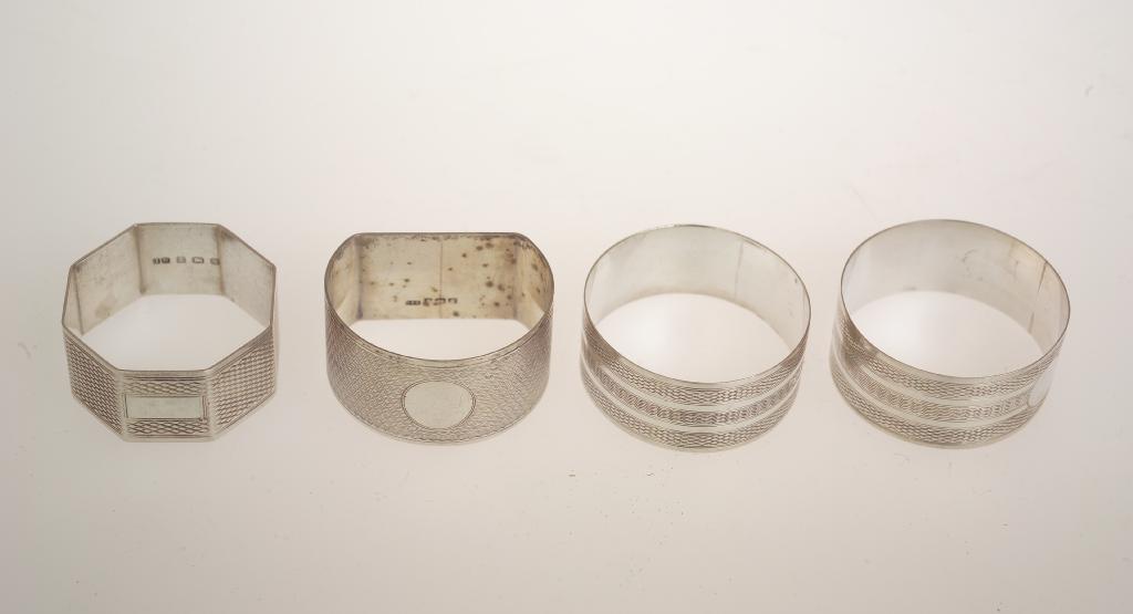 Appraisal: PAIR OF SILVER NAPKIN RINGS BIRMINGHAM with engine-turned decoration together