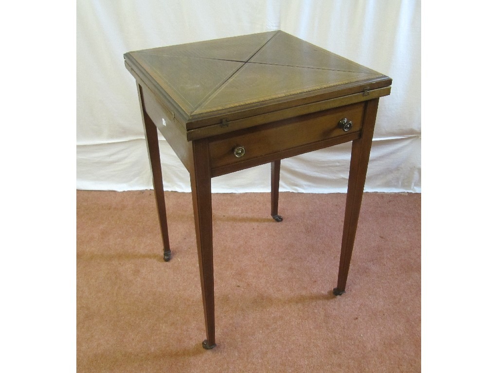 Appraisal: An Edwardian mahogany inlaid envelope card table raised on tapering