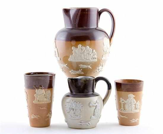 Appraisal: Royal Doulton stoneware pitchers and tumblers circa sprigged overall with