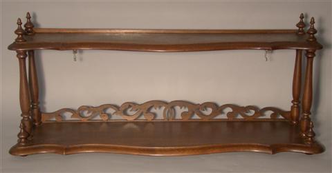 Appraisal: VICTORIAN MAHOGANY HANGING SHELF The shaped rectangular top above a