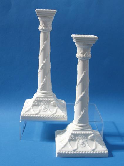 Appraisal: A PAIR OF ROYAL WORCESTER WHITE GLAZE CANDLESTICKS in the