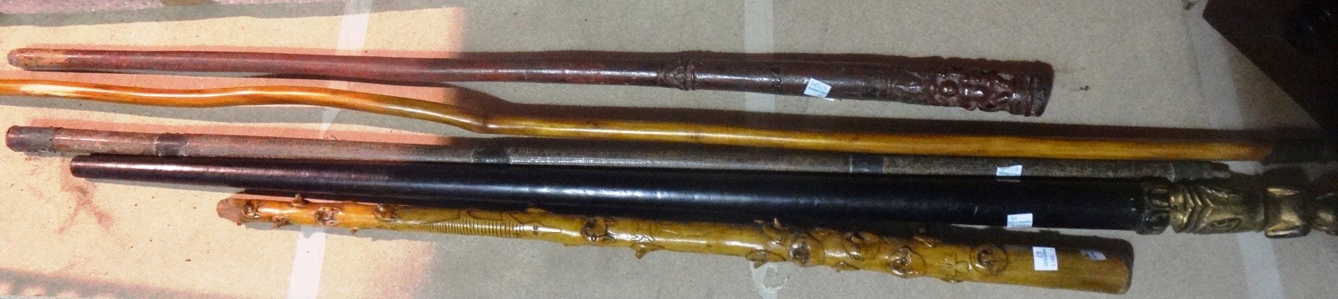 Appraisal: A group of five various Oriental walking sticks including one