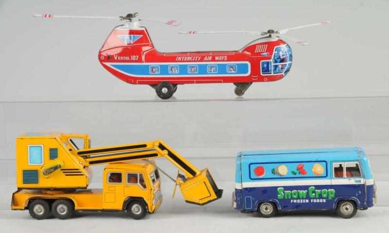 Appraisal: Lot of Tin Vehicle Friction Toys Description Japanese Working Includes