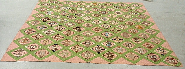 Appraisal: - Large pieced quilt in a green Tumbling Block pattern