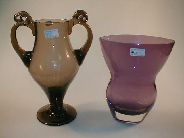 Appraisal: An amethyst glass vase of elliptical form with a clear