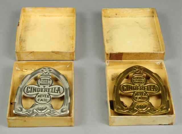 Appraisal: TWO IRON STANDS WITH BOXES Cinderella Brand includes nickeled and