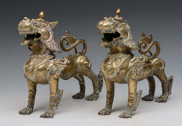 Appraisal: A PAIR OF BURMESE BRONZE METAL TEMPLE DOGS in ceremonial