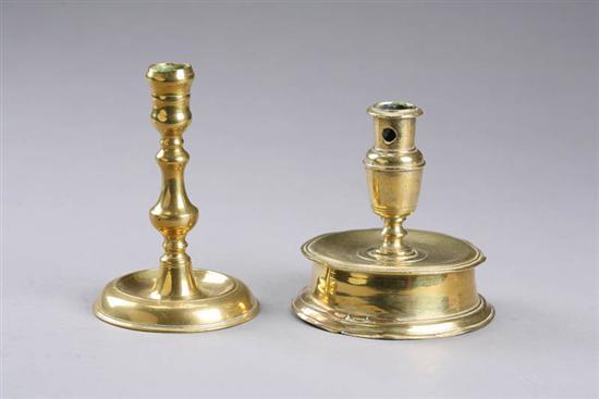 Appraisal: TWO BRASS CANDLESTICKS European Seventeenth century capstan stick Base has