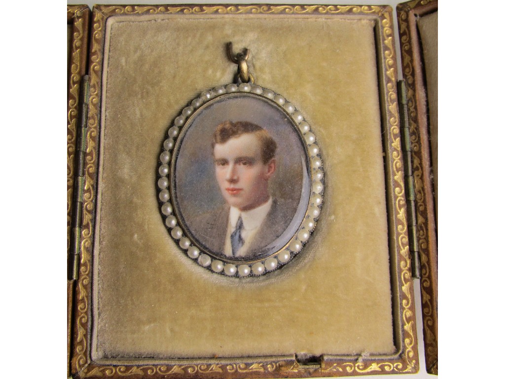 Appraisal: Victorian portrait miniature in open photo locket with seed pearl