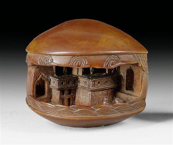 Appraisal: A BOXWOOD NETSUKE OF A CLAM WITH AN ORIENTAL MINIATURE