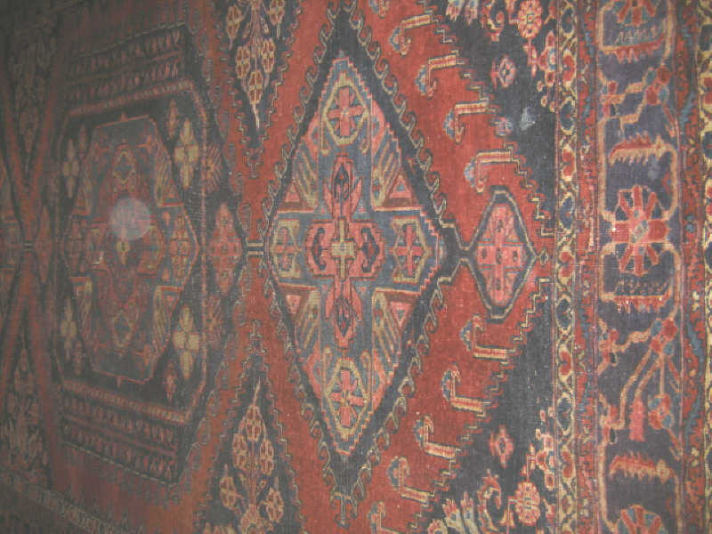 Appraisal: EARLY TH CENTURY PERSIAN ROOM RUG The red field shows