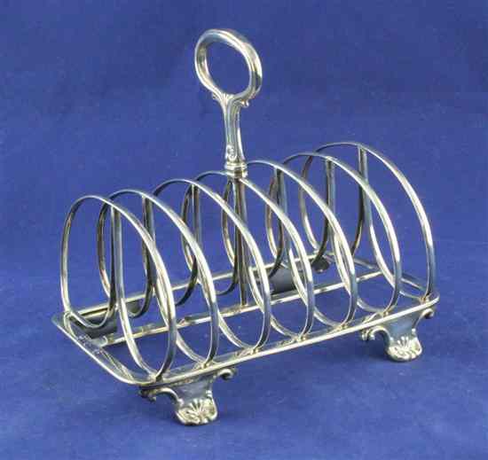 Appraisal: A William IV silver seven bar toast rack of rounded