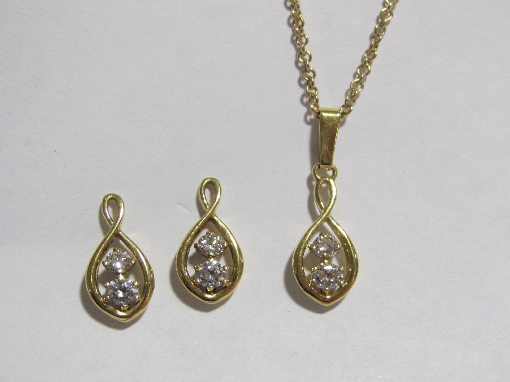 Appraisal: An eighteen carat gold diamond pendant and earring set each