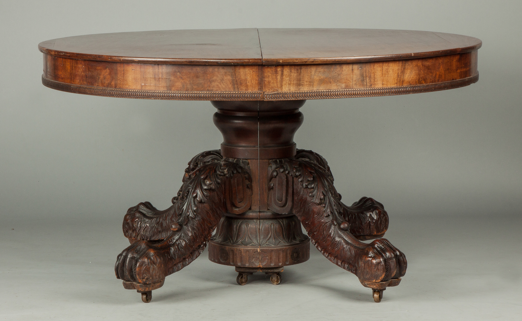 Appraisal: Mahogany Dining Table th cent Heavily carved pedestal base with