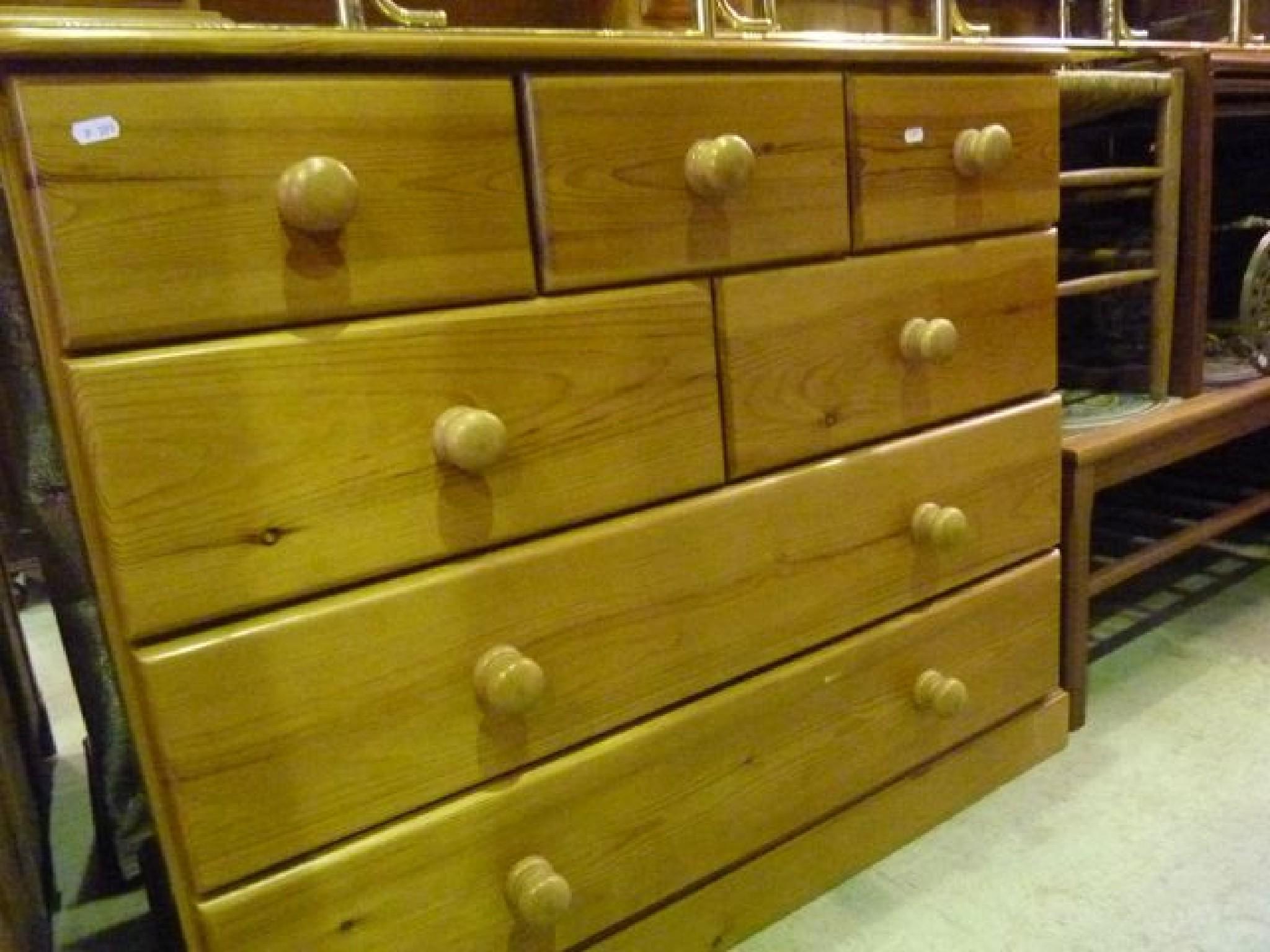 Appraisal: A modern stripped pine chest fitted with an arrangement of