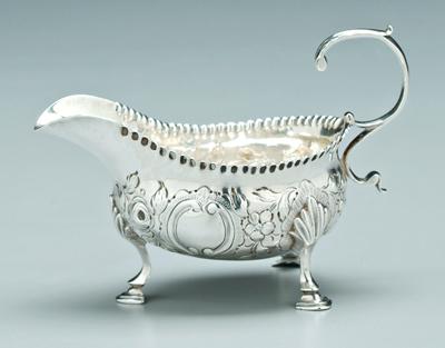 Appraisal: George III English silver sauceboat oval with S scroll handle