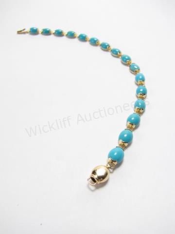 Appraisal: A K yellow gold bracelet with sixteen oval Persian turquoise