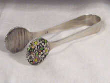 Appraisal: A small pair of tongs with finely formed floral design