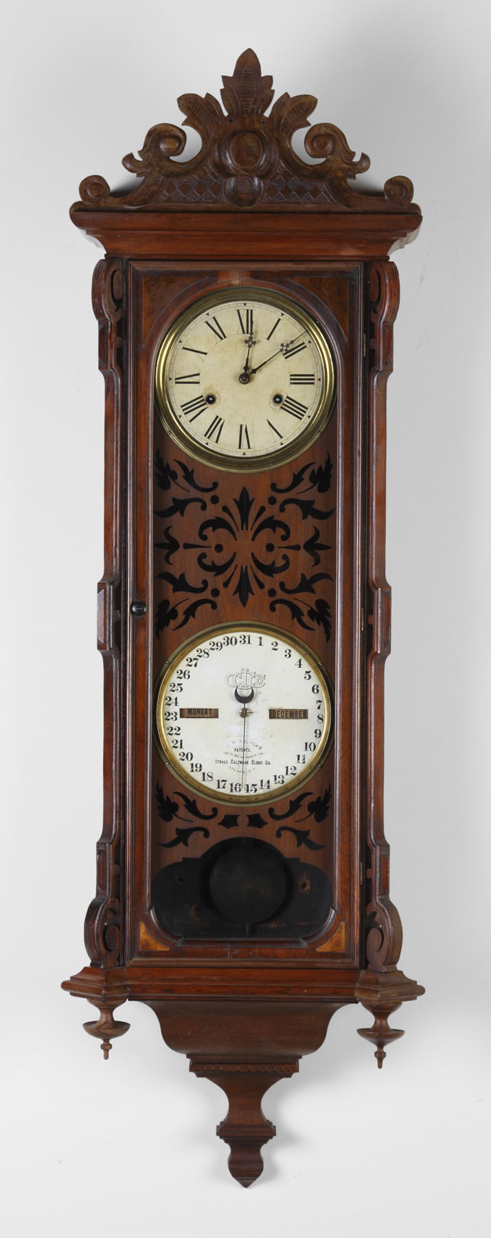 Appraisal: Ithaca Vienna Wall Calendar Walnut case with pierced fretwork old