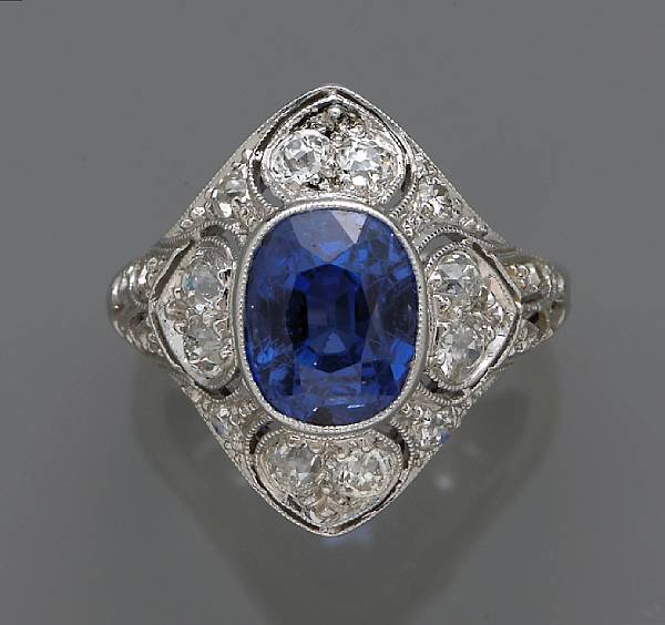 Appraisal: An Edwardian sapphire and diamond ring centering an oval-shaped sapphire